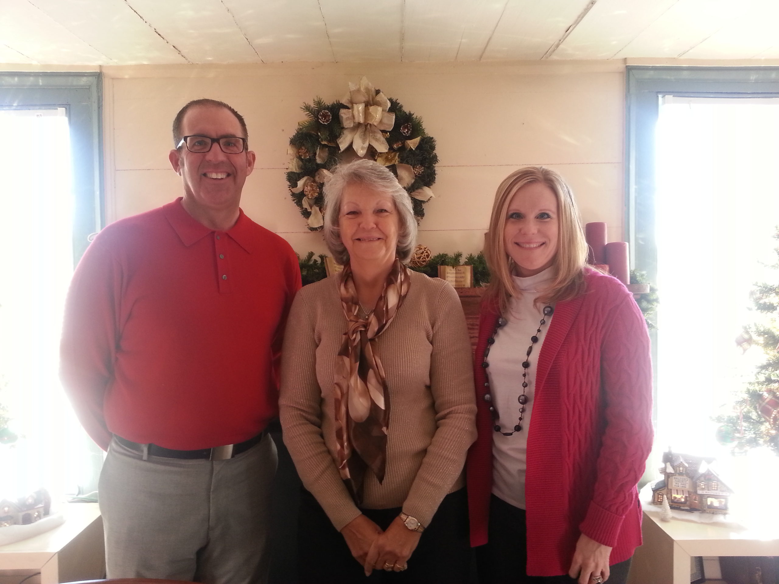 John Prescott, Laura Henderson, and Michelle Autry celebrating Laura’s retirement