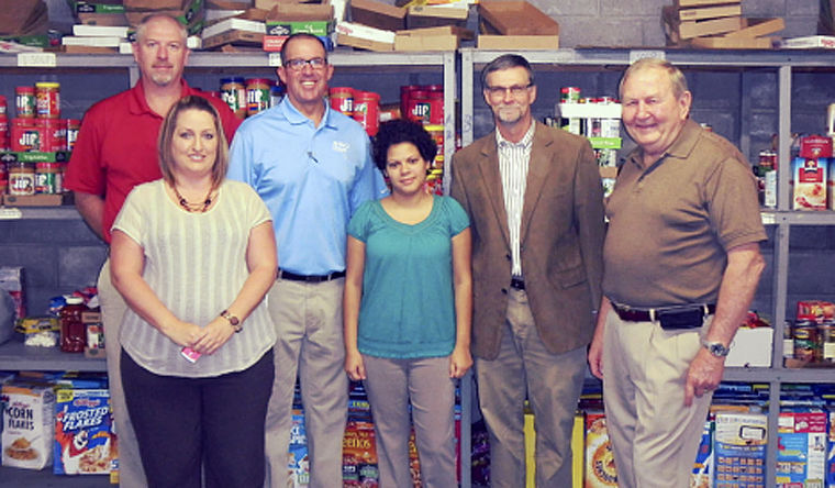 Southeast Corrections and Colquitt County Food Bank representatives with donated food